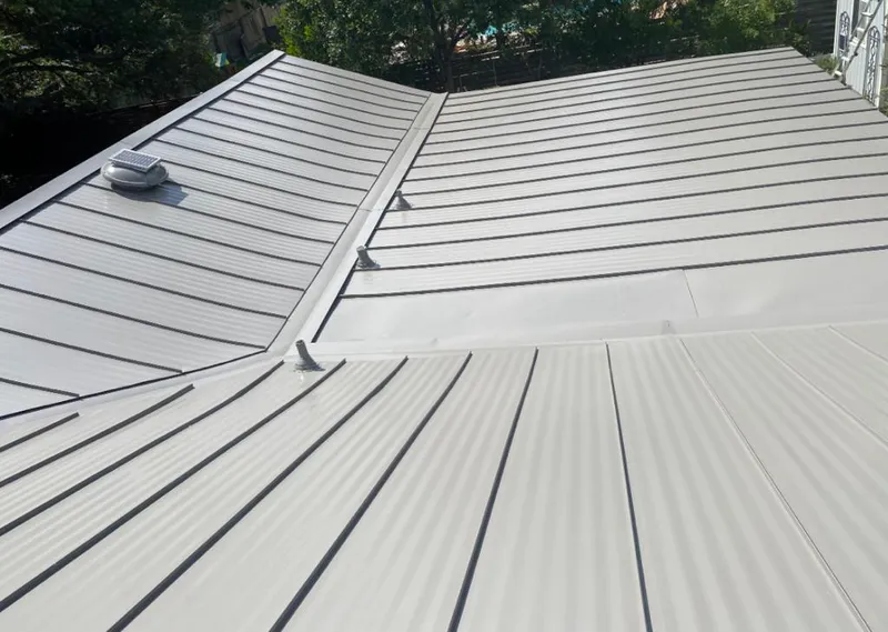 Solar attic fan installed on a metal roof for Roof Ventilation in Calumet Park